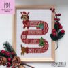 Cross stitch pattern of a dog in a Christmas sweater