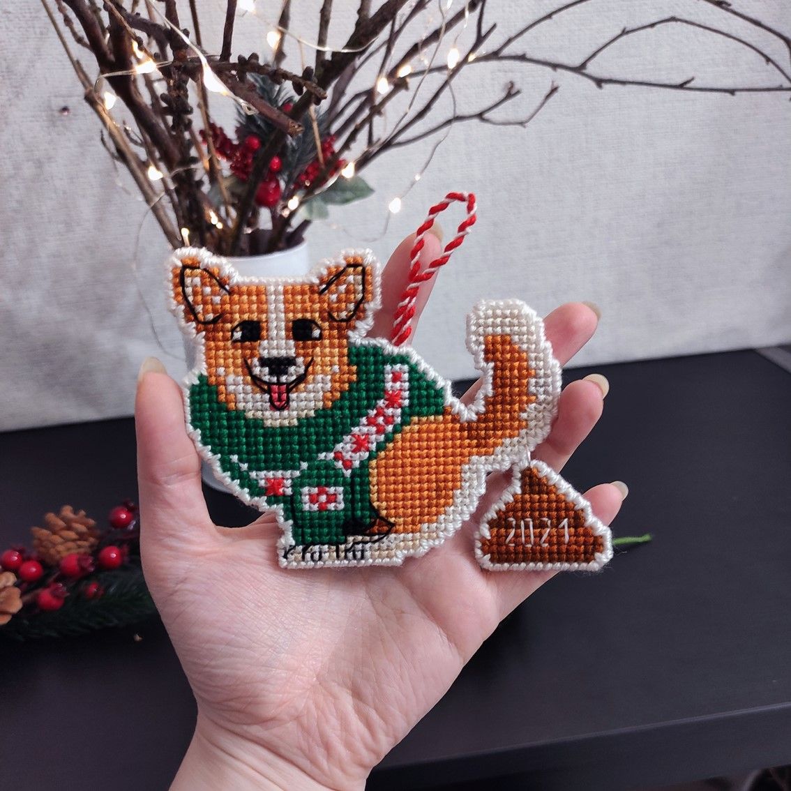 A funny Christmas-themed cross stitch pattern featuring a bad pooping dog, Christmas plastic canvas pattern