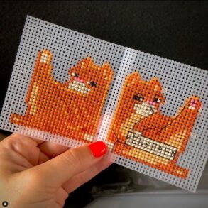 Red cat bookmark cross stitched on plastic canvas