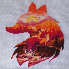 Red fox silhouette with landscape cross stitch ornament